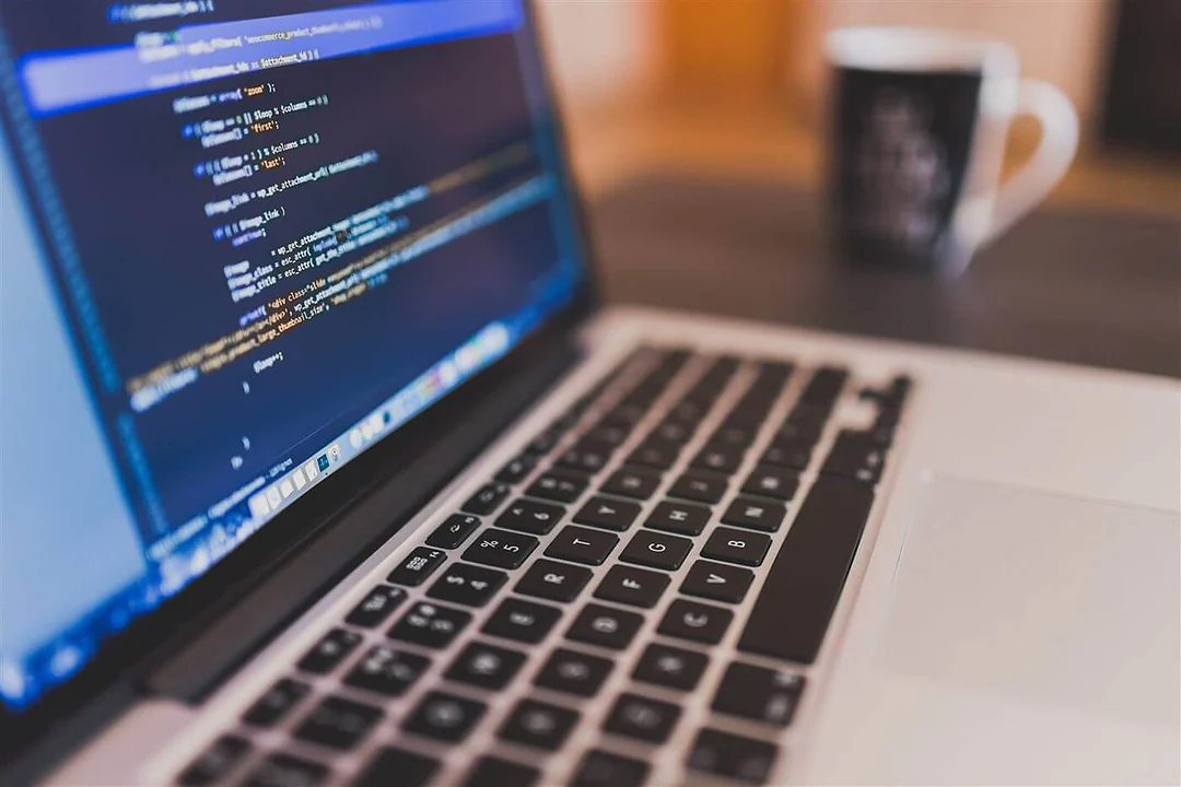 Close-up of a laptop with code on the screen